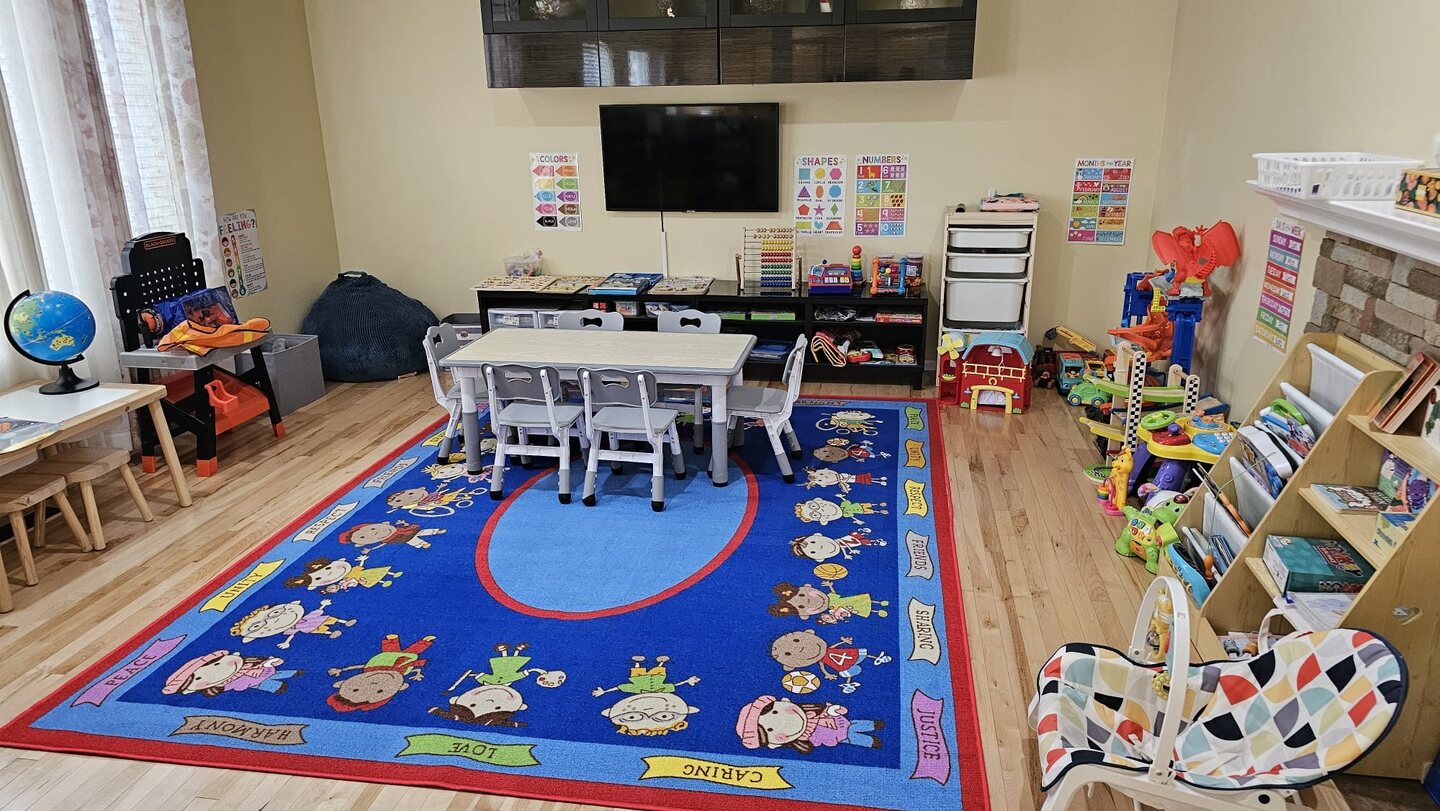 Our playroom with child-sized furniture, books, and toys