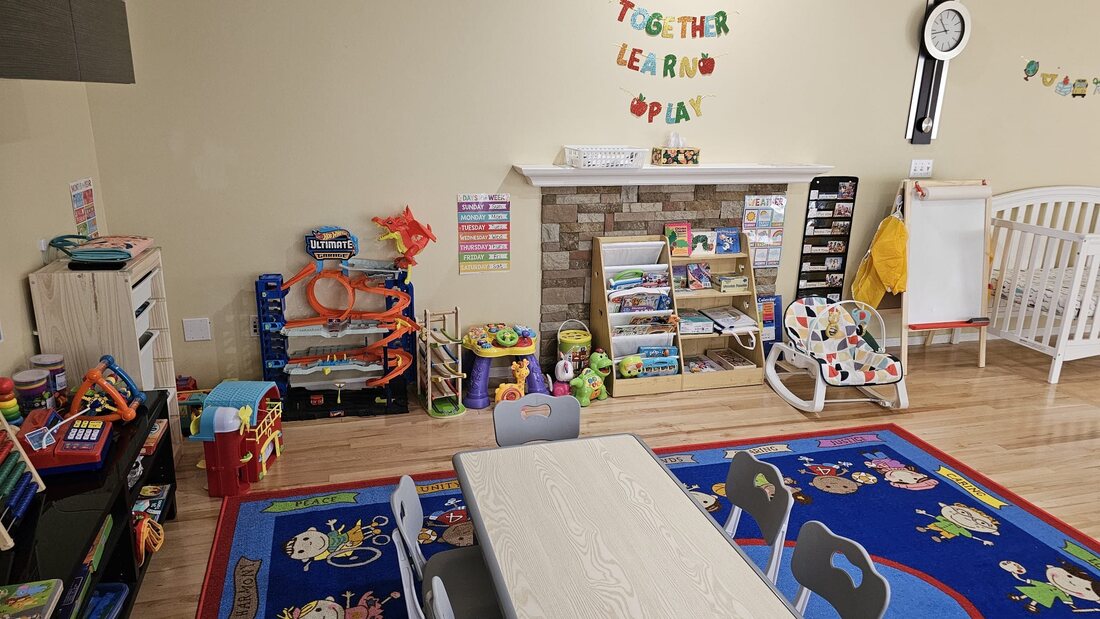 Books, toys, and a Together Learn Play banner